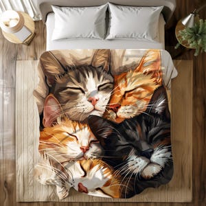 May include: A colorful duvet cover featuring a close-up of four cats sleeping together. The cats are a tabby, a black and white cat, and two orange and white cats. The cats are all curled up together in a pile, with their eyes closed and their paws tucked under their bodies.