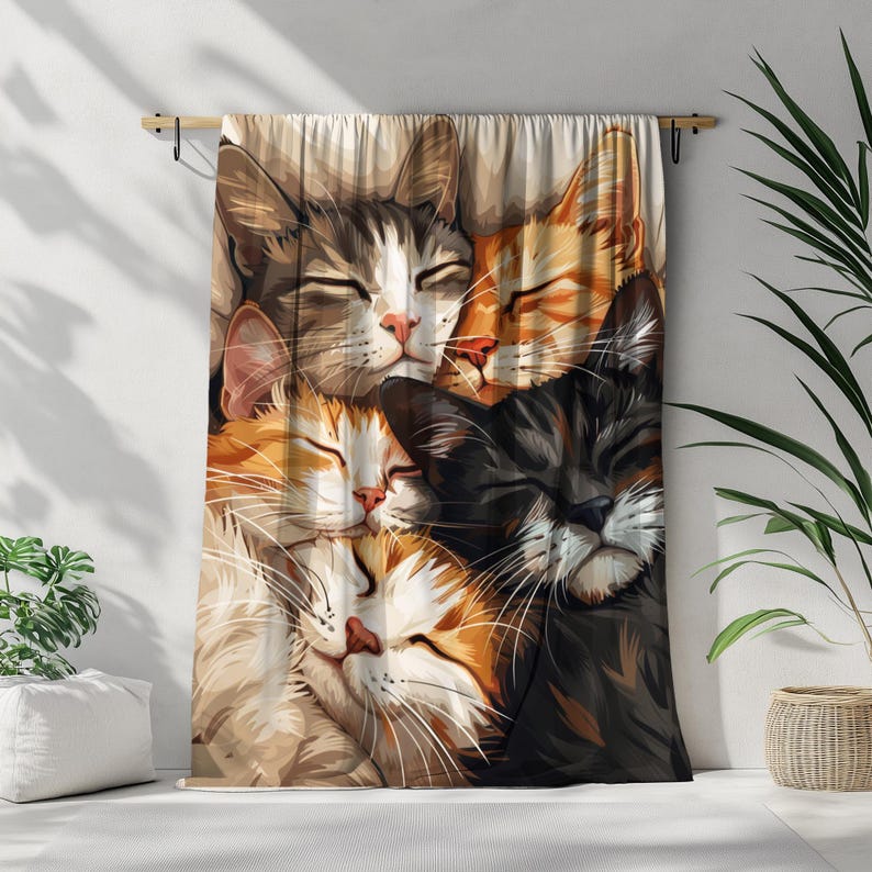 May include: A tapestry featuring a close-up of four cats sleeping together. The cats are a mix of brown, black, and white fur. The tapestry is a soft, beige color and has a subtle texture.