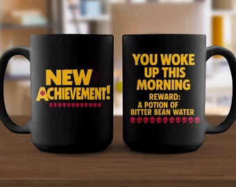 Taza de logro, taza de café con agua de frijol amargo, divertida taza de café matutino, taza novedosa, taza de logro desbloqueado