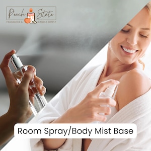 May include: A clear glass bottle with a silver spray nozzle. The bottle is labeled "Room Spray/Body Mist Base".