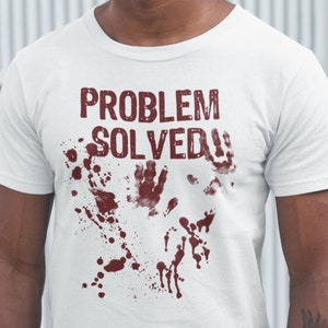 May include: White t-shirt with red blood splatter and the text "PROBLEM SOLVED!" in red.