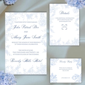 May include: Elegant wedding invitation suite in white with delicate blue floral accents. The invitation includes the names John Patrick Doe and Mary Jane Smith, along with event details. Additional cards provide RSVP and website information.
