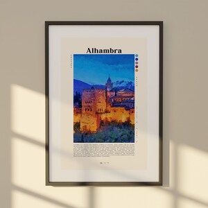 Puede incluir: Una impresi&oacute;n enmarcada del palacio de la Alhambra en Granada, Espa&ntilde;a. La imagen es una pintura de acuarela del palacio al atardecer, con un cielo azul y naranja vibrante. El texto "Alhambra" est&aacute; impreso en negro en la parte superior de la impresi&oacute;n.