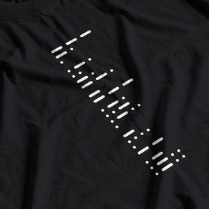 May include: A black t-shirt with a white graphic design of a series of diagonal lines and dots.