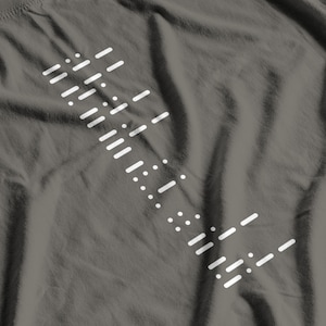 May include: Gray t-shirt with a white graphic design of a series of lines and dots.
