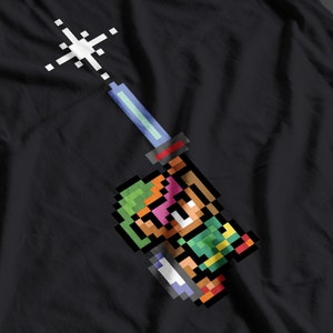 The Sword! It&#39;s dangerous to go alone! Take this. Retro gaming inspired pixel T-Shirt