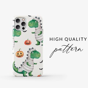 May include: A white iPhone case with a repeating pattern of green mummies, orange pumpkins, and black bats. The text "HIGH QUALITY pattern" is visible on the right side of the image.