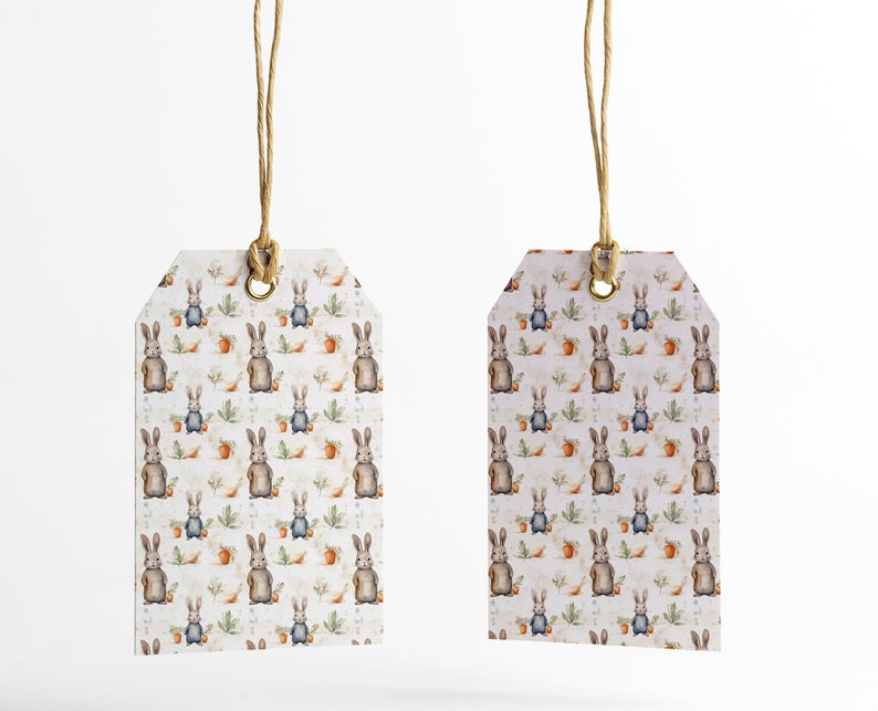 May include: Two white gift tags with a brown bunny rabbit pattern. The tags are tied with twine and have a brass eyelet.