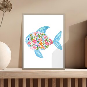 Blue fish with floral pattern on framed artwork.
