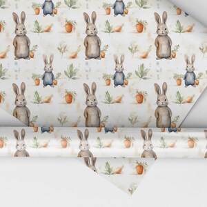 May include: White wrapping paper with a repeating pattern of brown rabbits, green leaves, and orange carrots.
