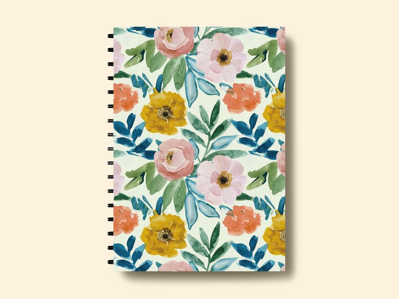 May include: A spiral bound notebook with a floral pattern. The cover features a watercolor design of pink, yellow, and orange flowers with green leaves on a white background.