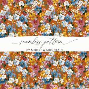 May include: A seamless floral pattern featuring a variety of colorful flowers in shades of blue, yellow, pink, and white against a rust-colored background. The text "seamless pattern" and "BY MOORE & MOUNTAIN" are displayed on a white banner.