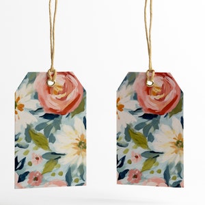 May include: Two floral gift tags with a blue, green, white and pink floral pattern. The tags are attached to twine.