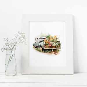 May include: A vintage blue pickup truck filled with colorful flowers in baskets. The truck is driving on a dirt road with green trees in the background. The image is painted in a watercolor style.
