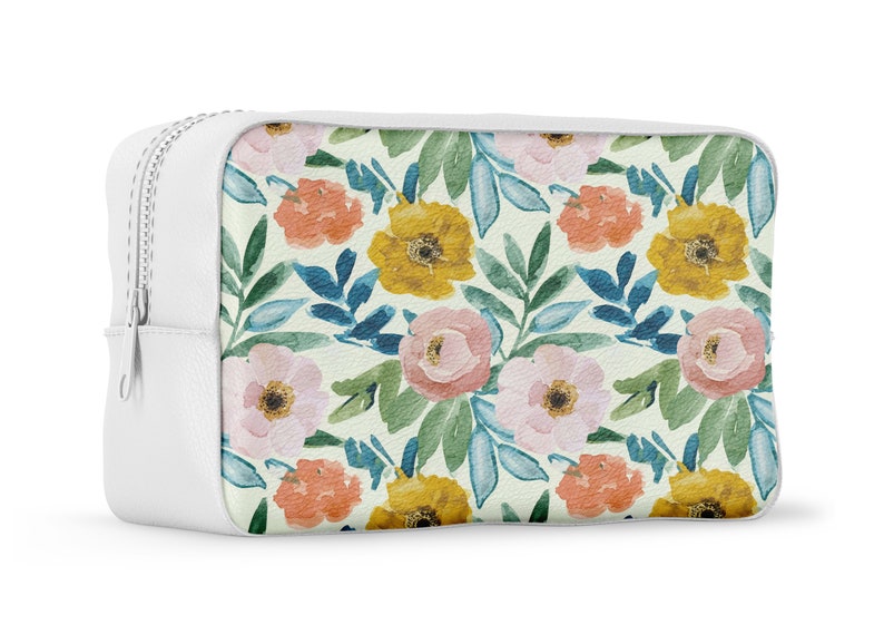 May include: White zippered pouch with a floral print featuring pink, yellow, and orange flowers on a light green background.