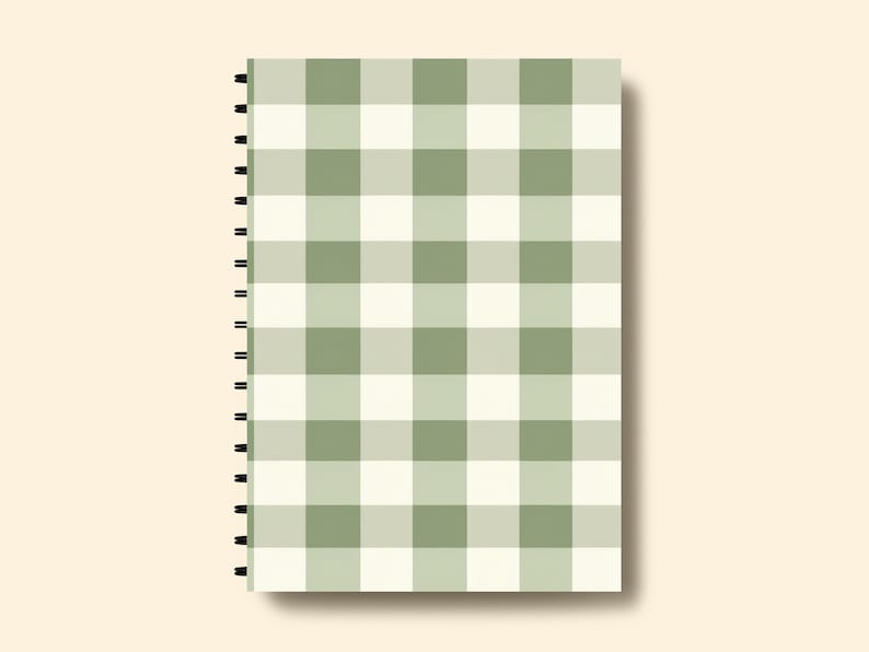 May include: A green and white checkered spiral bound notebook. The notebook has a simple design and is perfect for taking notes or journaling.