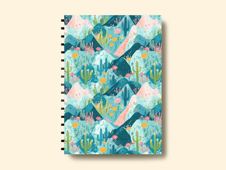 May include: A spiral bound notebook with a colorful pattern of cacti and mountains in shades of blue, green, pink, and yellow.