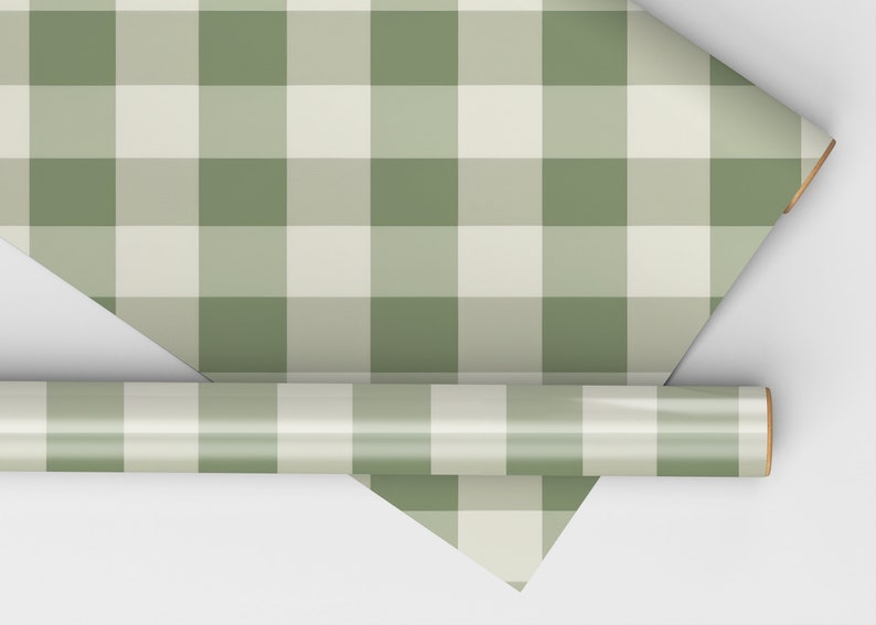 May include: A roll of green and white gingham wrapping paper. The paper is rolled up and the end is visible.