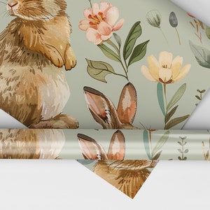 May include: A green wrapping paper with a repeating pattern of brown rabbits, pink and yellow flowers, and green leaves.