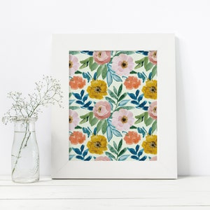 May include: A white frame with a floral print featuring pink, yellow, and orange flowers on a light green background.