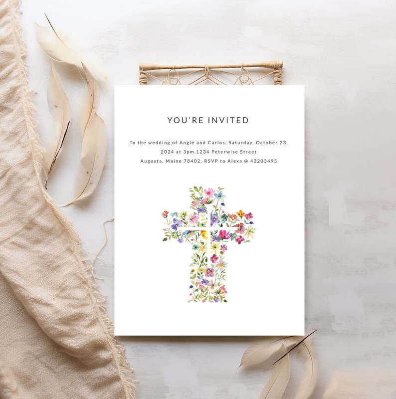 May include: Wedding invitation with a floral cross design. The text reads "You're Invited" to the wedding of Angie and Carlos, Saturday, October 23, 2024 at 3pm. 1234 Peterwise Street, Augusta, Maine 78402. RSVP to Alexa @ 43203495.