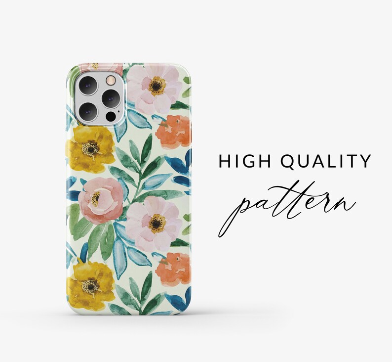 May include: A phone case with a floral pattern. The case features a white background with pink, yellow, and orange flowers, and green and blue leaves. The case has a camera cutout and a "HIGH QUALITY pattern" text.
