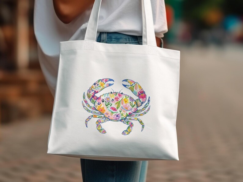 White tote bag with a colorful floral crab design.