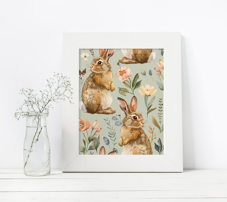 May include: A white framed print with a repeating pattern of brown rabbits and pastel flowers on a light green background.