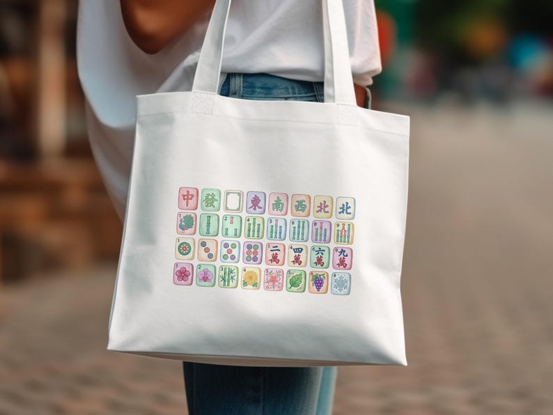 White tote bag with colorful Mahjong tiles and Chinese characters.