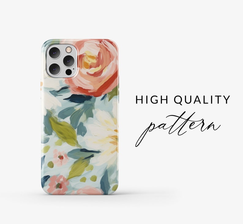 May include: A phone case with a floral pattern. The case features a light blue background with pink, white, and red flowers. The case has a camera cutout for a triple lens camera.