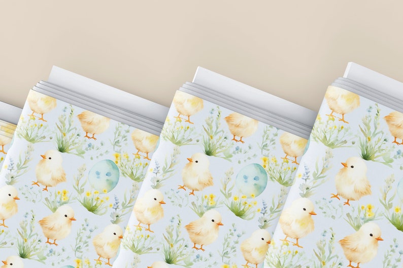 May include: A stack of blue and white patterned paper with a watercolor design of yellow chicks and flowers. The paper is perfect for wrapping gifts or creating crafts.