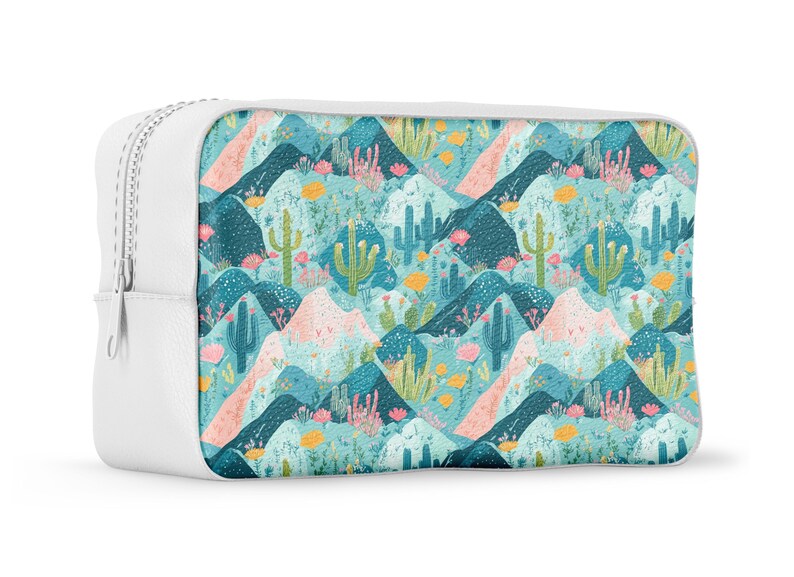 May include: White zippered pouch with a colorful pattern of cacti and mountains on a blue background.