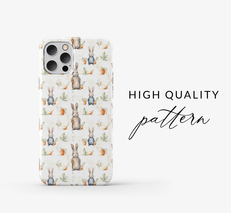 May include: A white iPhone case with a repeating pattern of brown rabbits holding carrots and blue rabbits with green leaves. The text "HIGH QUALITY pattern" is visible in the background.