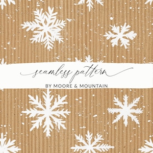 May include: A seamless pattern featuring white snowflakes on a brown textured background. The text "seamless pattern" and "BY MOORE & MOUNTAIN" is printed in white on a white banner.