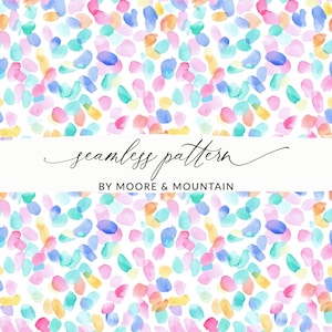 May include: A seamless pattern design with watercolour brushstrokes in pink, blue, yellow, and green on a white background. The text "seamless pattern" and "BY MOORE & MOUNTAIN" are displayed in a banner across the image.