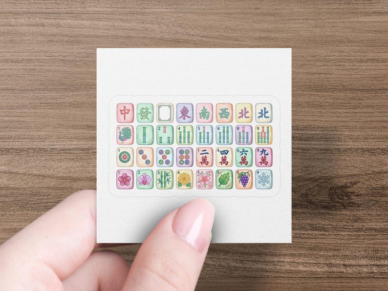 Mahjong tiles with Chinese characters and numbers displayed on a sticker.