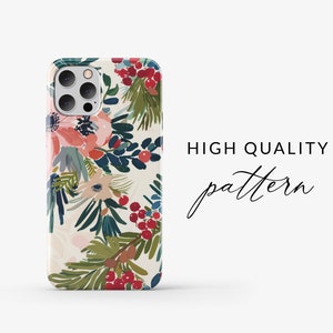 May include: A white iPhone case with a floral pattern featuring red berries, green leaves, and pink flowers. The text "HIGH QUALITY pattern" is visible in the background.