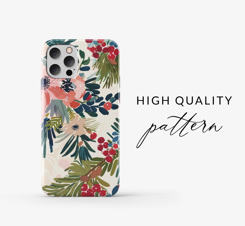 May include: A white iPhone case with a floral pattern featuring red berries, green leaves, and pink flowers. The text "HIGH QUALITY pattern" is visible in the background.