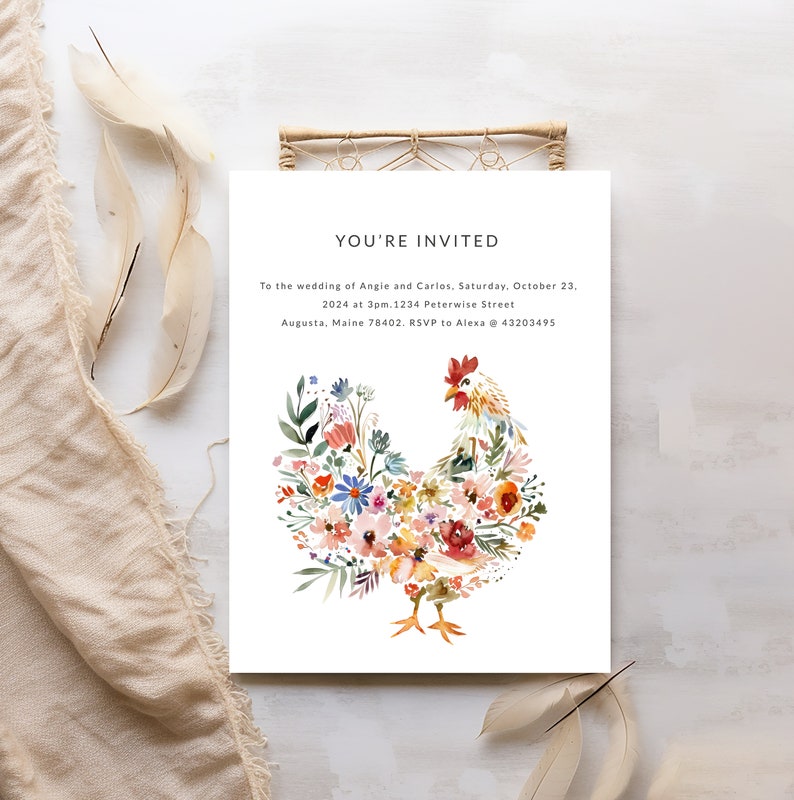 May include: A wedding invitation with a watercolor illustration of a rooster made of flowers. The text reads "You're Invited" to the wedding of Angie and Carlos, Saturday, October 23, 2024 at 3pm. 1234 Peterwise Street, Augusta, Maine 78402. RSVP to Alexa @ 43203495.