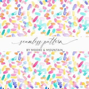 May include: A seamless pattern design with vibrant watercolor brushstrokes in pink, yellow, blue, and orange on a white backdrop. The words "seamless pattern" are in cursive, with "BY MOORE & MOUNTAIN" underneath.