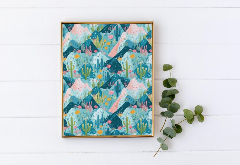 May include: A framed print with a repeating pattern of blue, pink, and green mountains with cacti and flowers. The frame is gold.