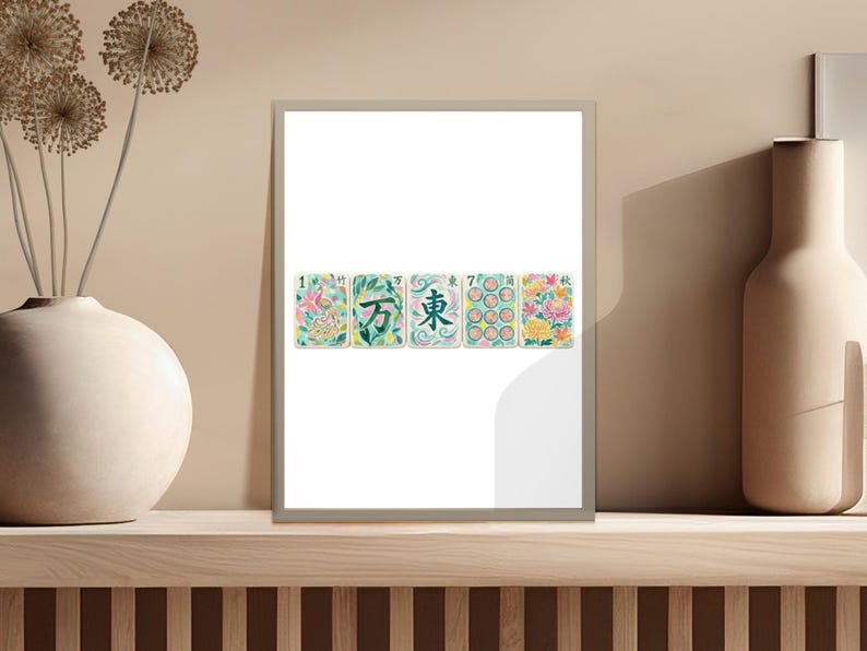 Framed display of five Mahjong tiles with Chinese characters and floral designs.
