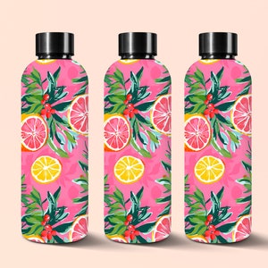 May include: Three pink water bottles with a citrus fruit and leaf pattern. The bottles have black lids.