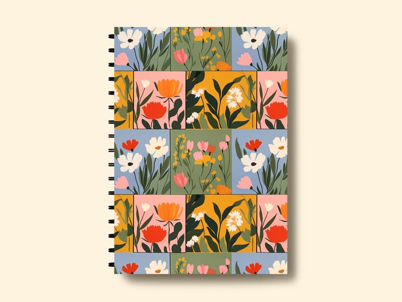 May include: A spiral bound notebook with a colourful floral pattern. The cover features a patchwork design of squares with different coloured backgrounds and various flowers in shades of pink, red, yellow, white, and green.