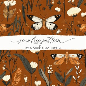 May include: A seamless pattern featuring white and orange butterflies on a brown background with white flowers and green leaves. The text "seamless pattern by Moore & Mountain" is at the bottom of the image.