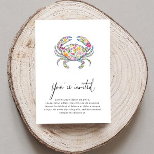 Watercolor floral crab on "You're invited" card with placeholder text.
