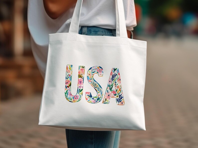 White tote bag with colorful floral letters spelling "USA".