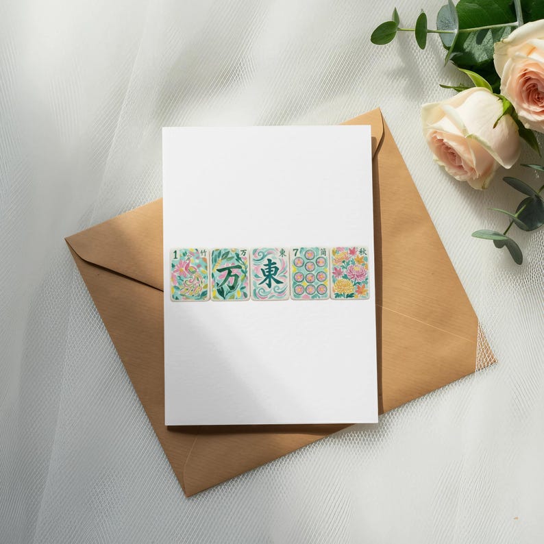 Card with mahjong tiles and roses on a brown envelope.