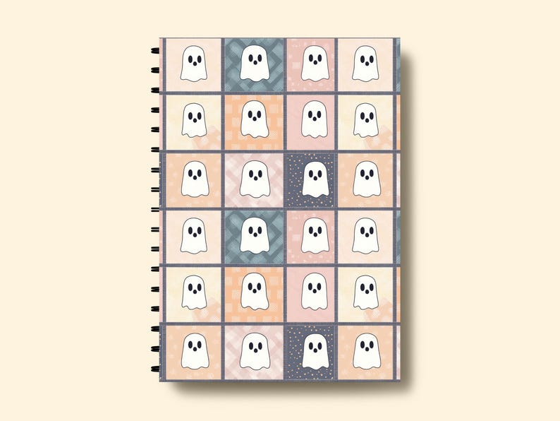 May include: A spiral-bound notebook with a repeating pattern of white ghost illustrations on a patchwork background. The squares alternate between pastel shades of peach, blue, and grey, some with a textured design.