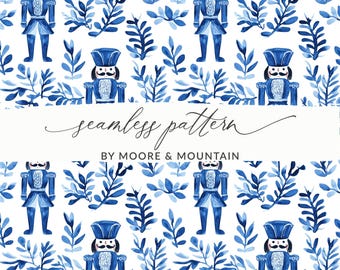 May include: A seamless pattern featuring blue watercolor illustrations of nutcracker soldiers and stylized leaves on a white background. The text "seamless pattern" and "BY MOORE & MOUNTAIN" is included in the design.